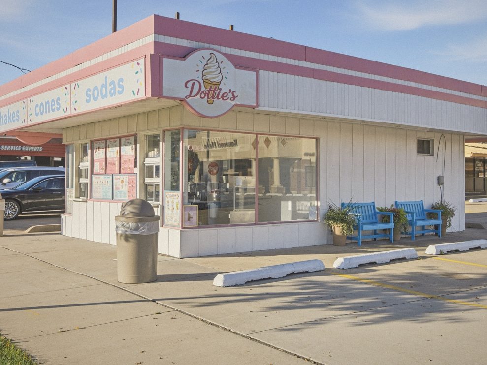 Dottie's Ice Cream & Soda, a pink and white retro ice cream shop with blue benches